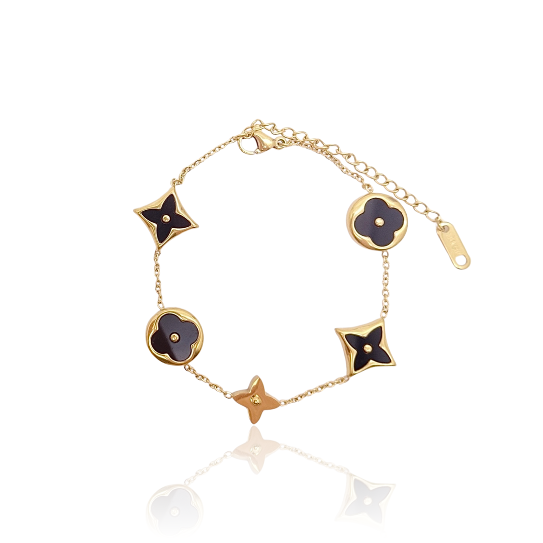 KIKICHIC | Gold Clover Multi Clover Charm Bracelet in White and Black, Anti Tarnish Waterproof, 14k Gold KIKICHIC | Gold Clover Multi Clover Charm Bracelet in White and Black, Anti Tarnish Waterproof, 14k Gold