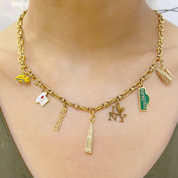 KIKICHIC NYC Charm Necklace. Gold Charm Necklace. Metro Card Charm Necklace. Yellow Taxi Charm Necklace, Empire State Building Charm Necklace, New York Word Charm Necklace, Fifth Avenue Street Sign Necklace, Metro Card Gold Charm Necklace.
