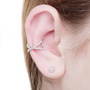 KIKICHIC Pave CZ Cross Ear Cuff. Hand-set Clear Cubic Zirconia stones. Adjustable Ear Cuff, No Piercing Necessary, just easily slip over the ear. This can be worn either on the left or right ear. Simple design but make a huge statement! Each of these ear cuffs are handcrafted of sterling silver, then plated with 14k rose gold and 14k white gold.